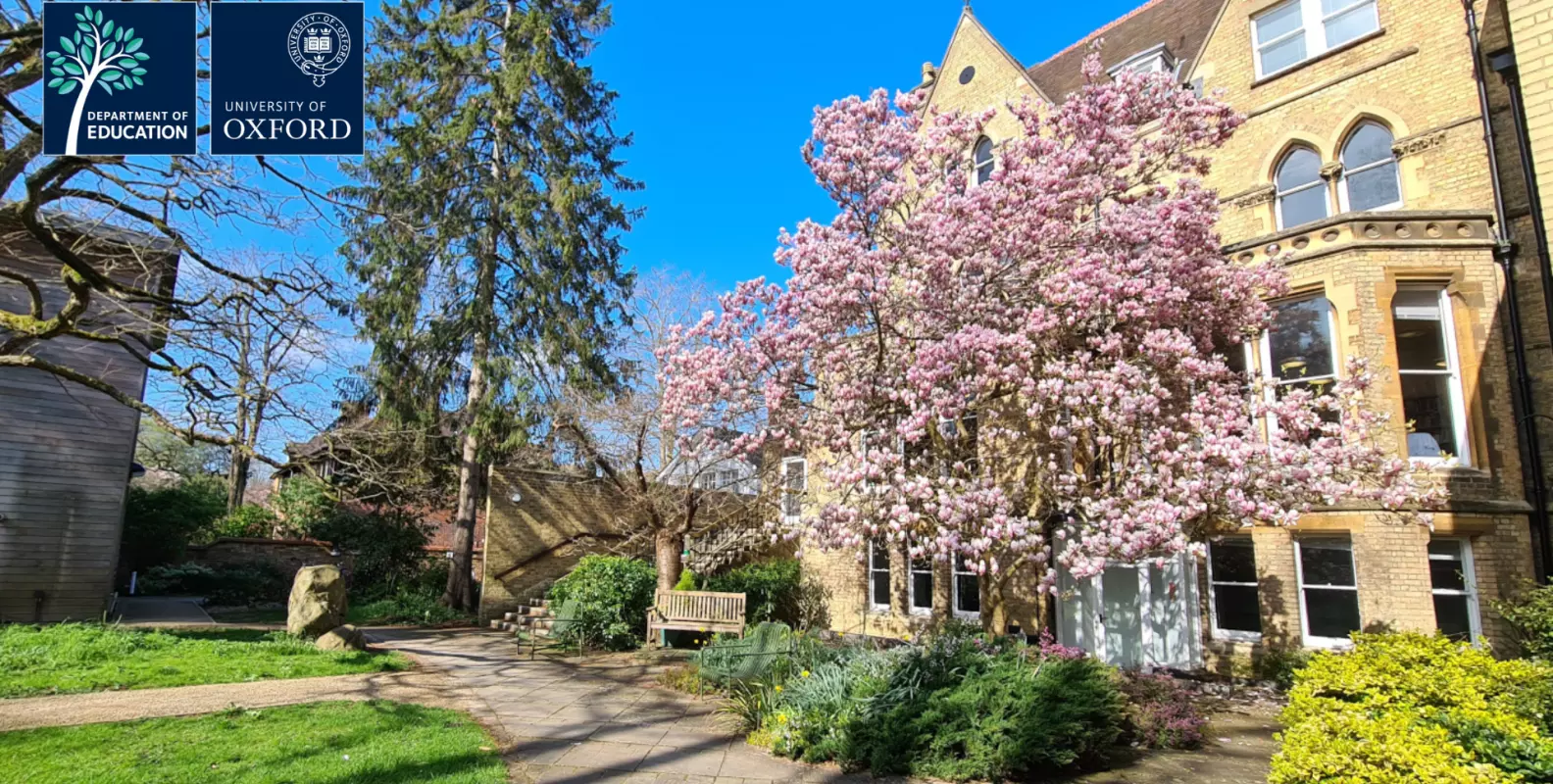 picture of the department in spring with magnolia tree.