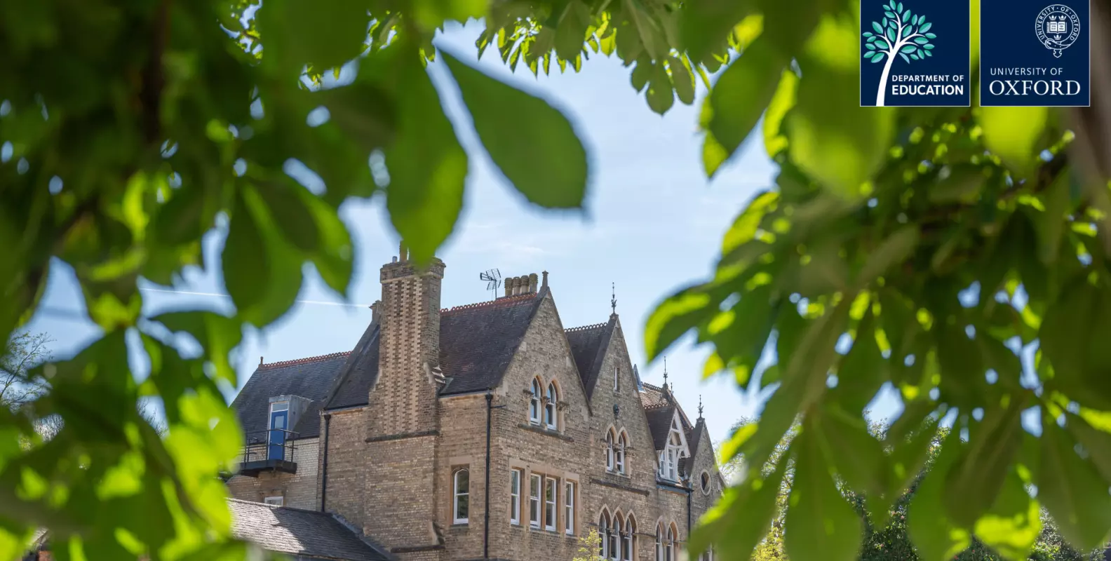 picture of the department in the summer through the trees